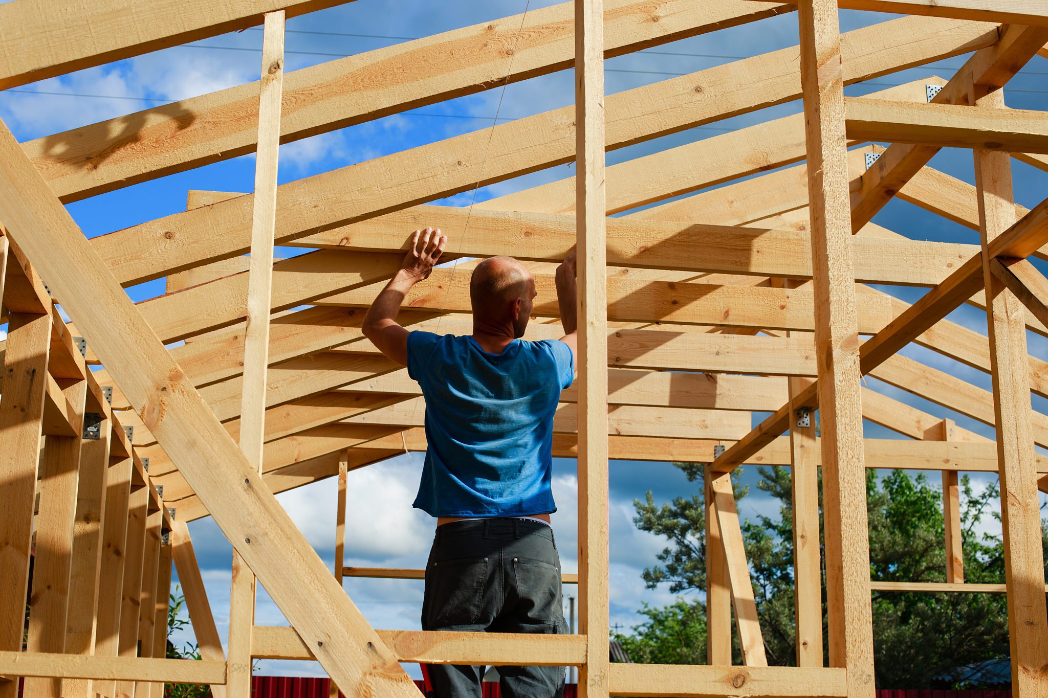 a man builds a house in the village