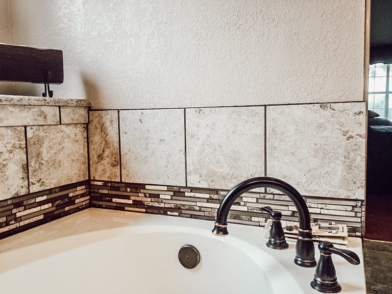 bathtub faucet and edge tiles