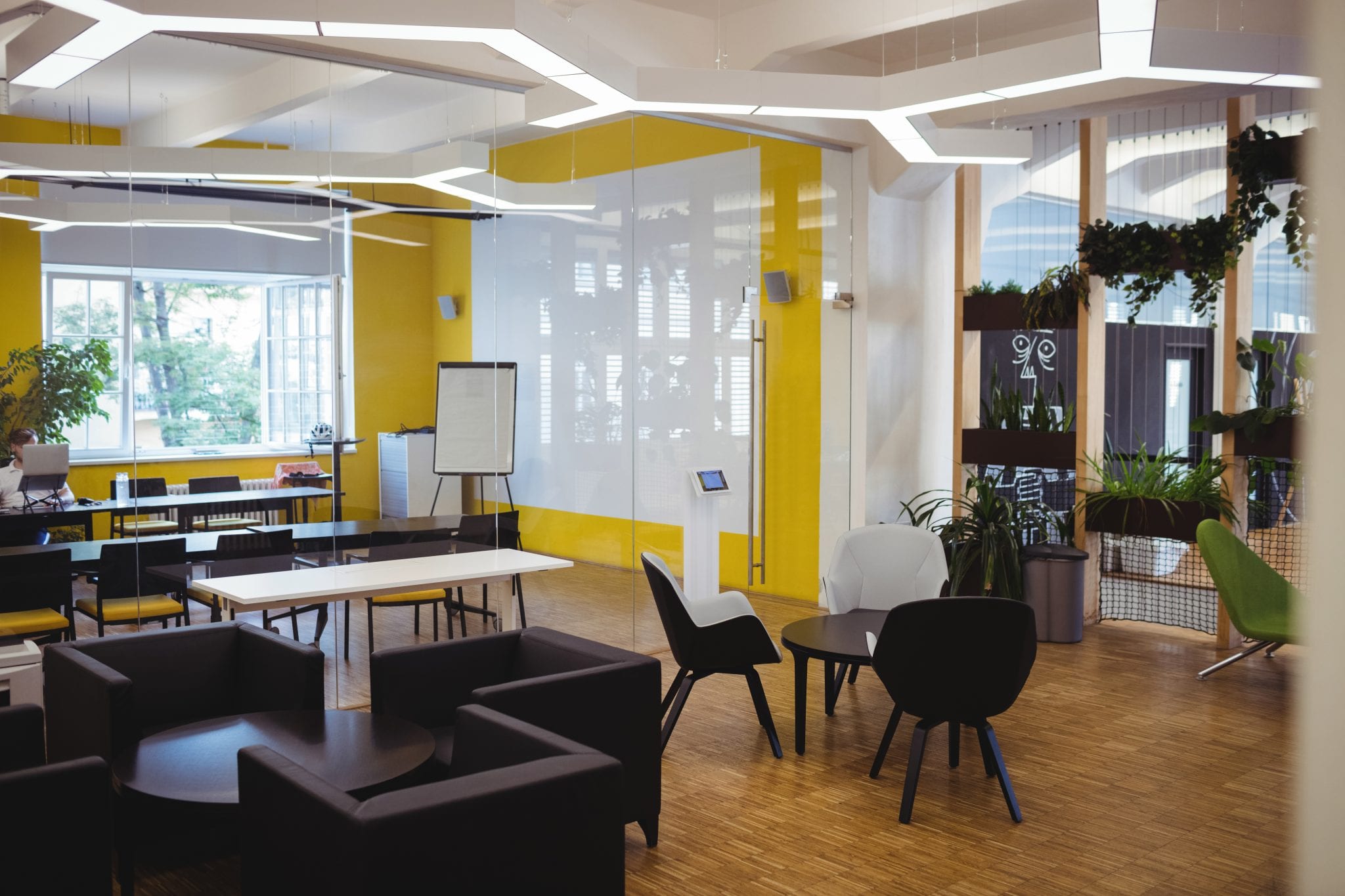 View of empty modern office with sofa, table, chair