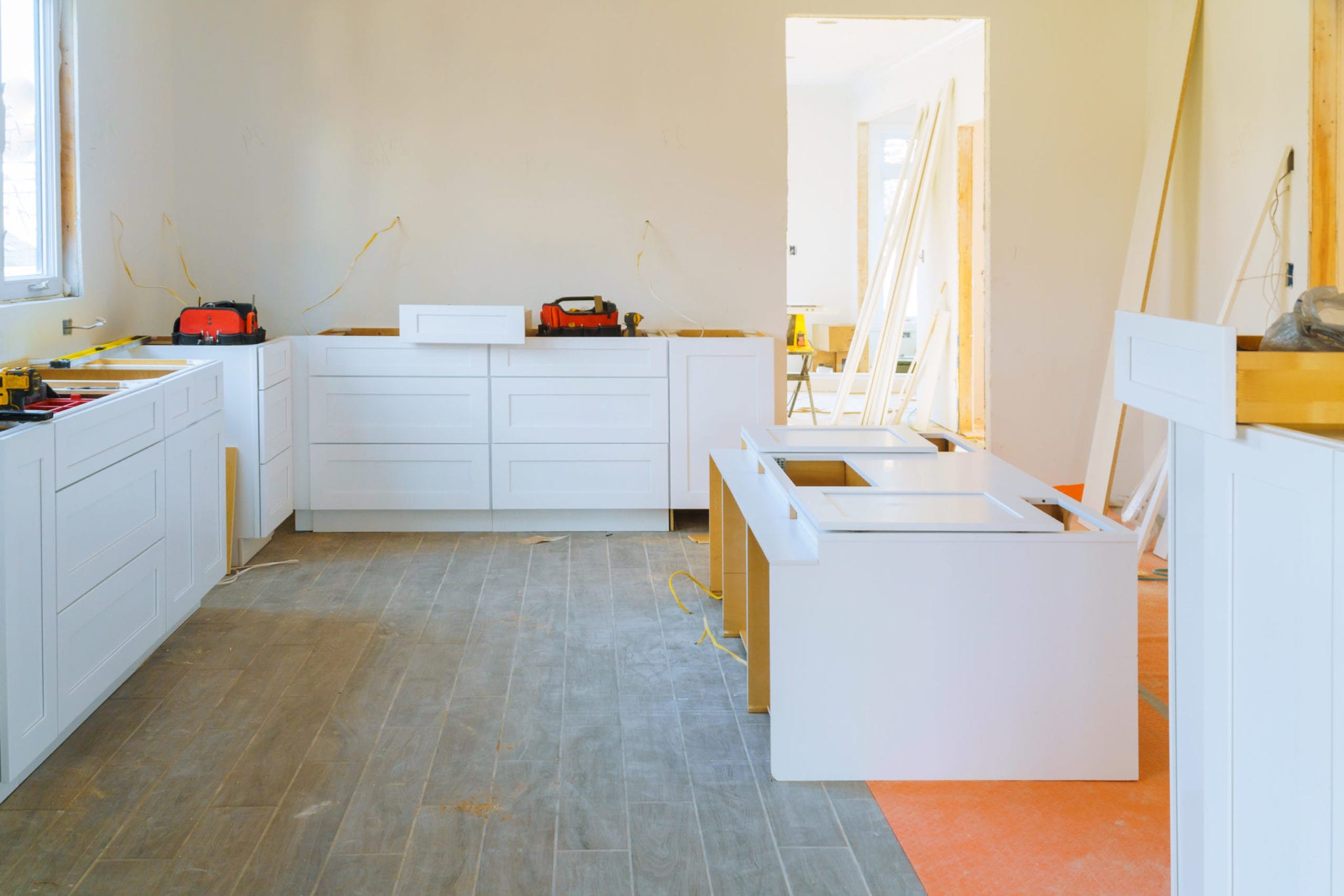 Installation modern kitchen cabinet closeup of furniture details.