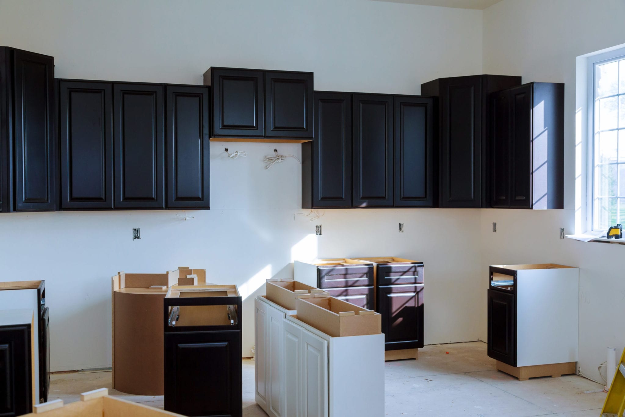 Kitchen cabinets installation Blind corner cabinet, island drawers and counter cabinets installed