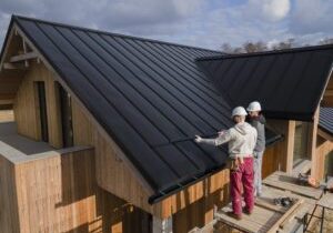 blue roof with contractors talking